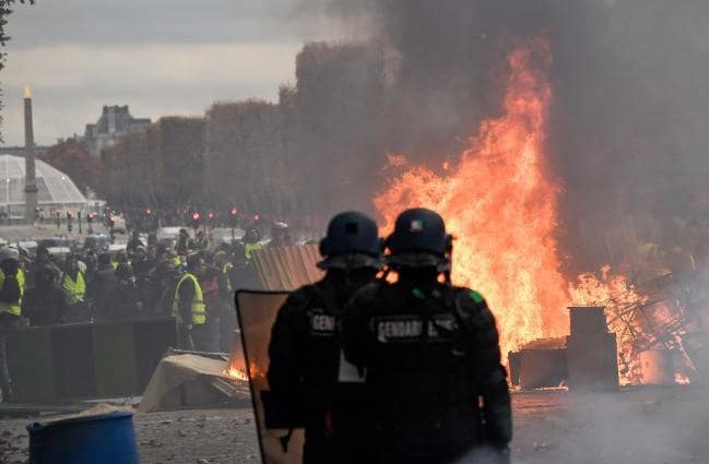 Riots over rising fuel costs plunge Paris into chaos as police struggle to maintain order