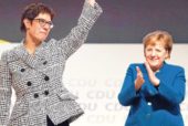 Merkel favourite takes the reins as ruling party votes for moderation